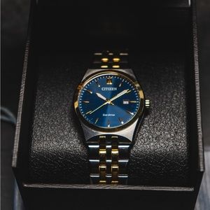 This beautiful watch has been worn twice and it comes with extra links.